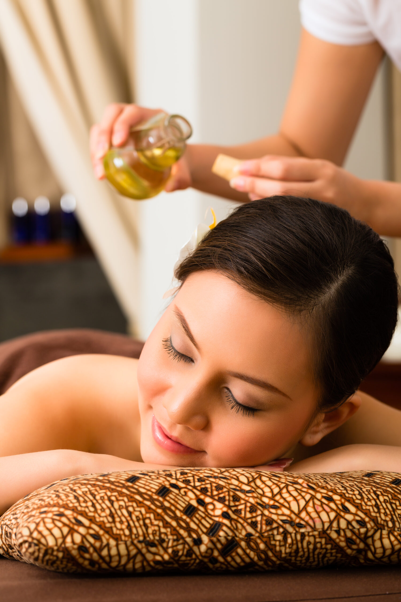 chinese asian woman wellness beauty spa having aroma therapy massage with essential oil looking relaxed scaled
