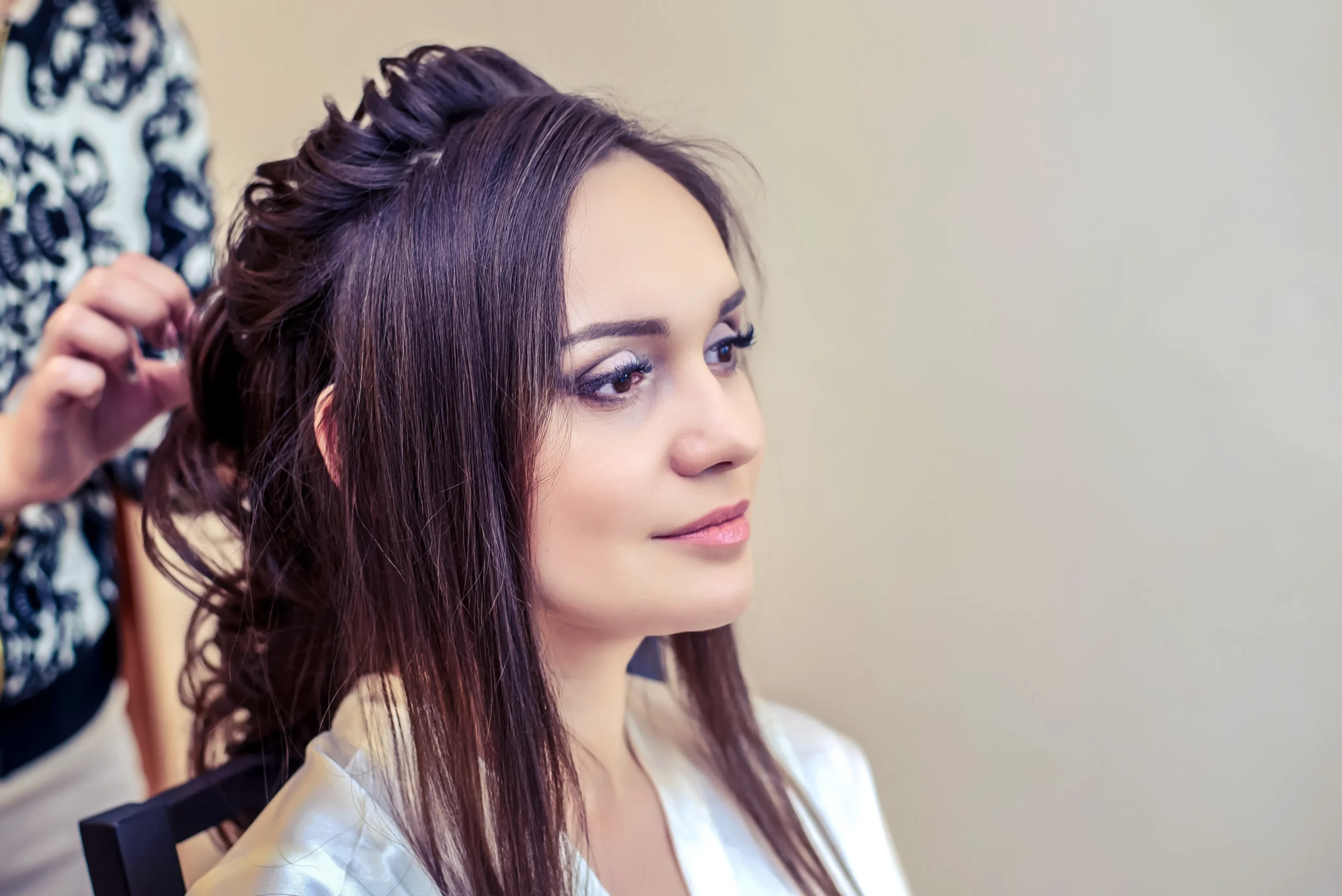 hairdresser makes bride beautiful hairstyle long hair morning wedding scaled
